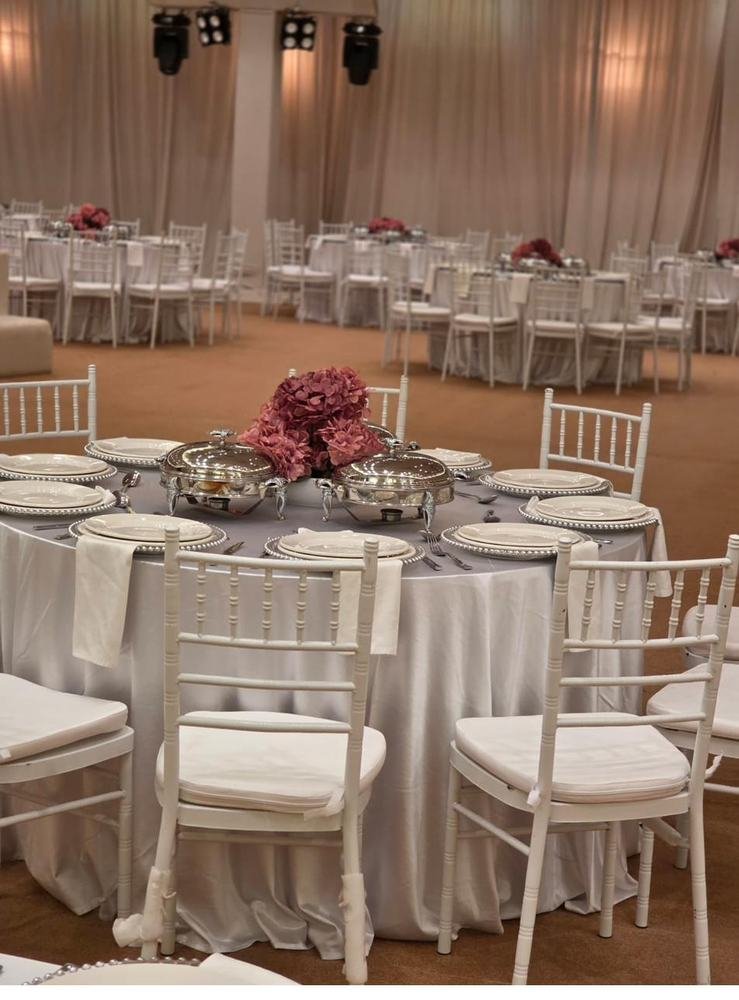 Banquet hall table setting with floral centrepiece