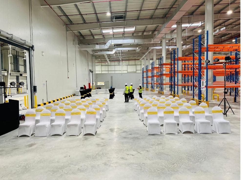 Corporate event chair setup in warehouse venue