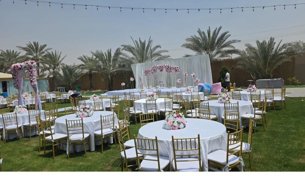Garden wedding ceremony stage with floral arch