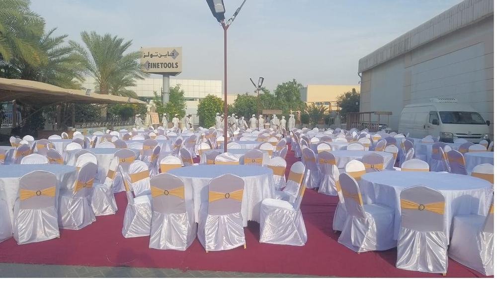 Large scale event with white and gold chair setup