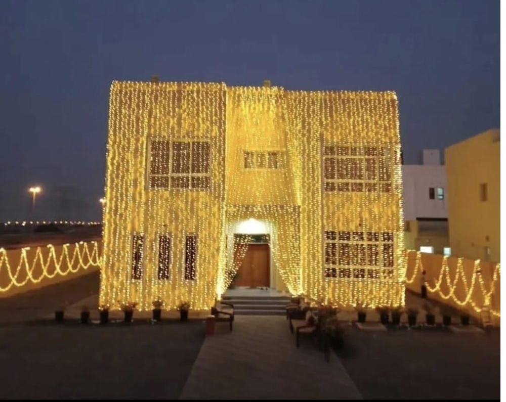 Villa entrance covered in string lights