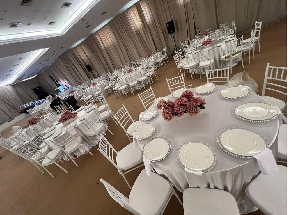 Wedding hall round table setup with florals