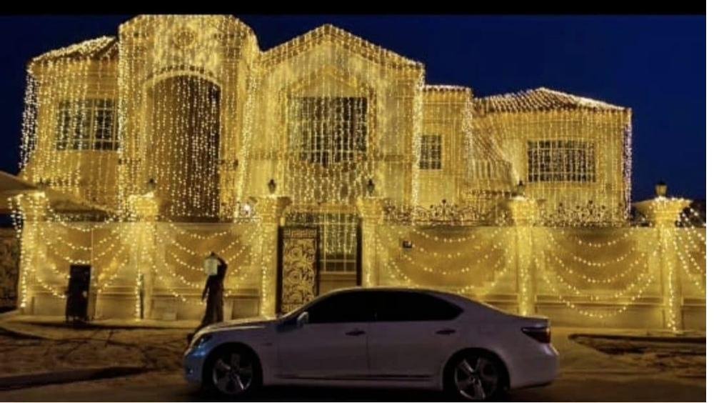 Villa exterior wrapped in fairy lights